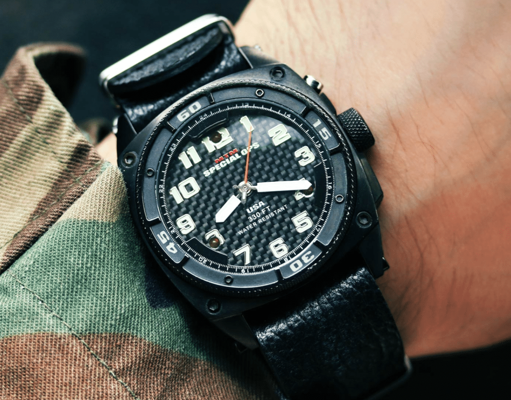 black MTM military watch on a soldier's hand