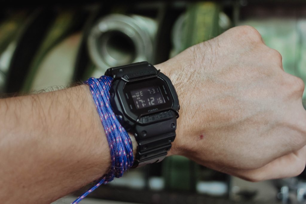 g-shock tactical watch with digital display on a man's wrist