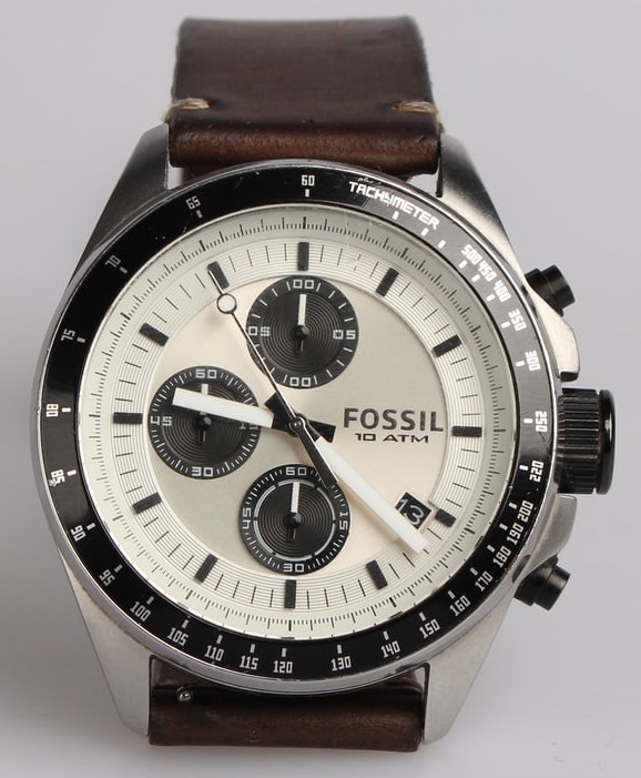 white-faced watch with dark subdials