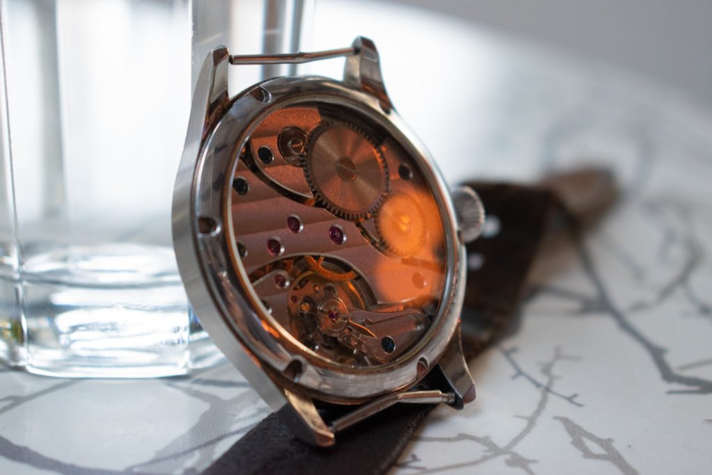 automatic movement watch with intricate build-up visible