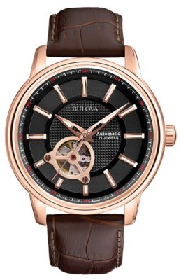 A rose-gold tone automatic skeleton watch with small aperture