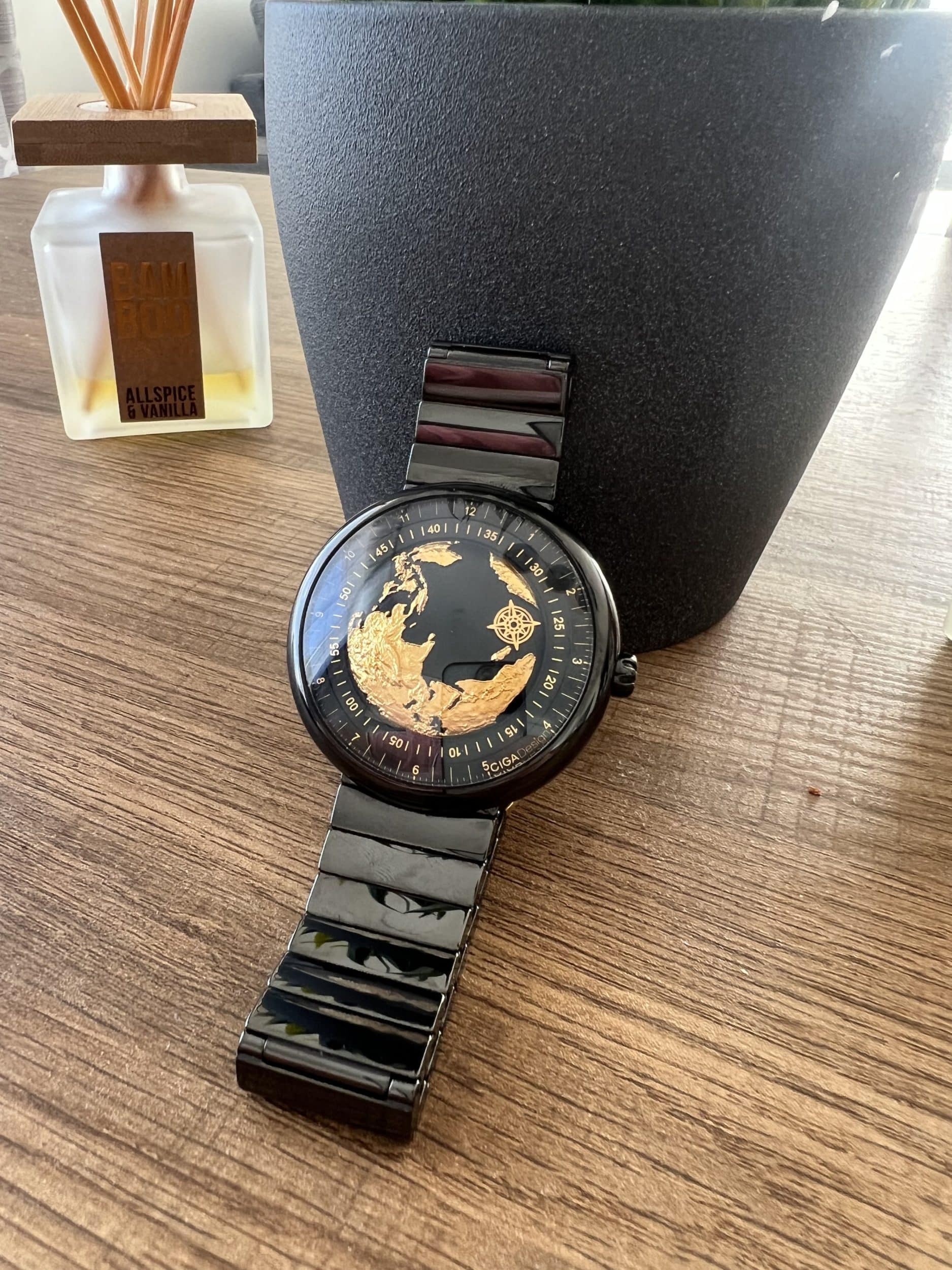 Gold and black watch on the table