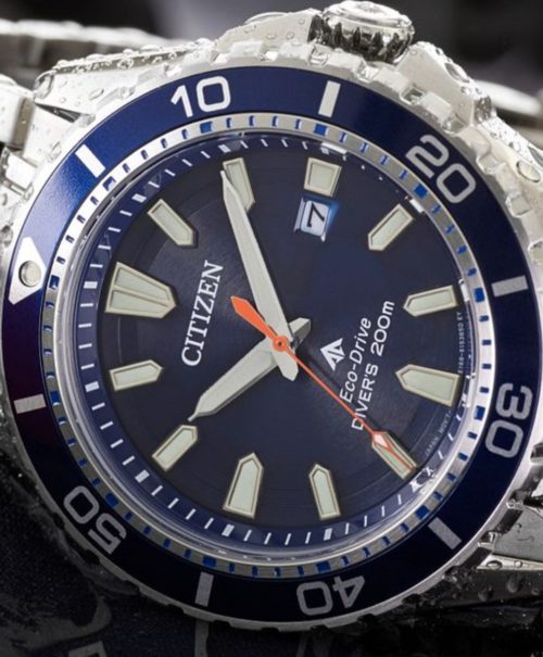 Watch with a blue dial and ridged bezel