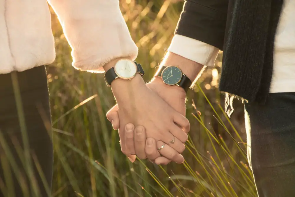 A couple wearing watches