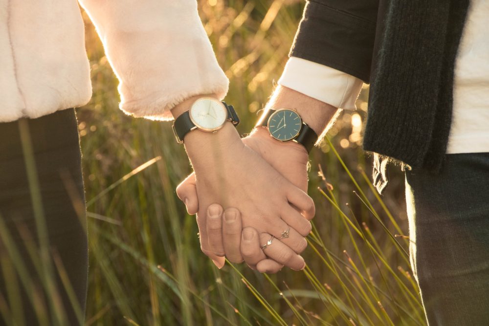 A couple wearing watches