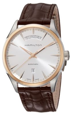 An automatic piece with golden case, white dial and leather band