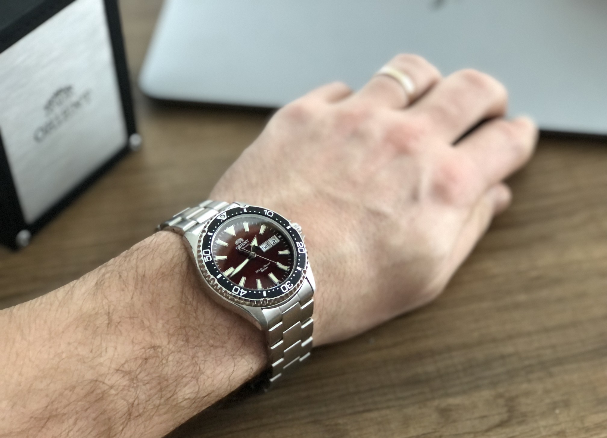 Watch on the left hand next to Macbook