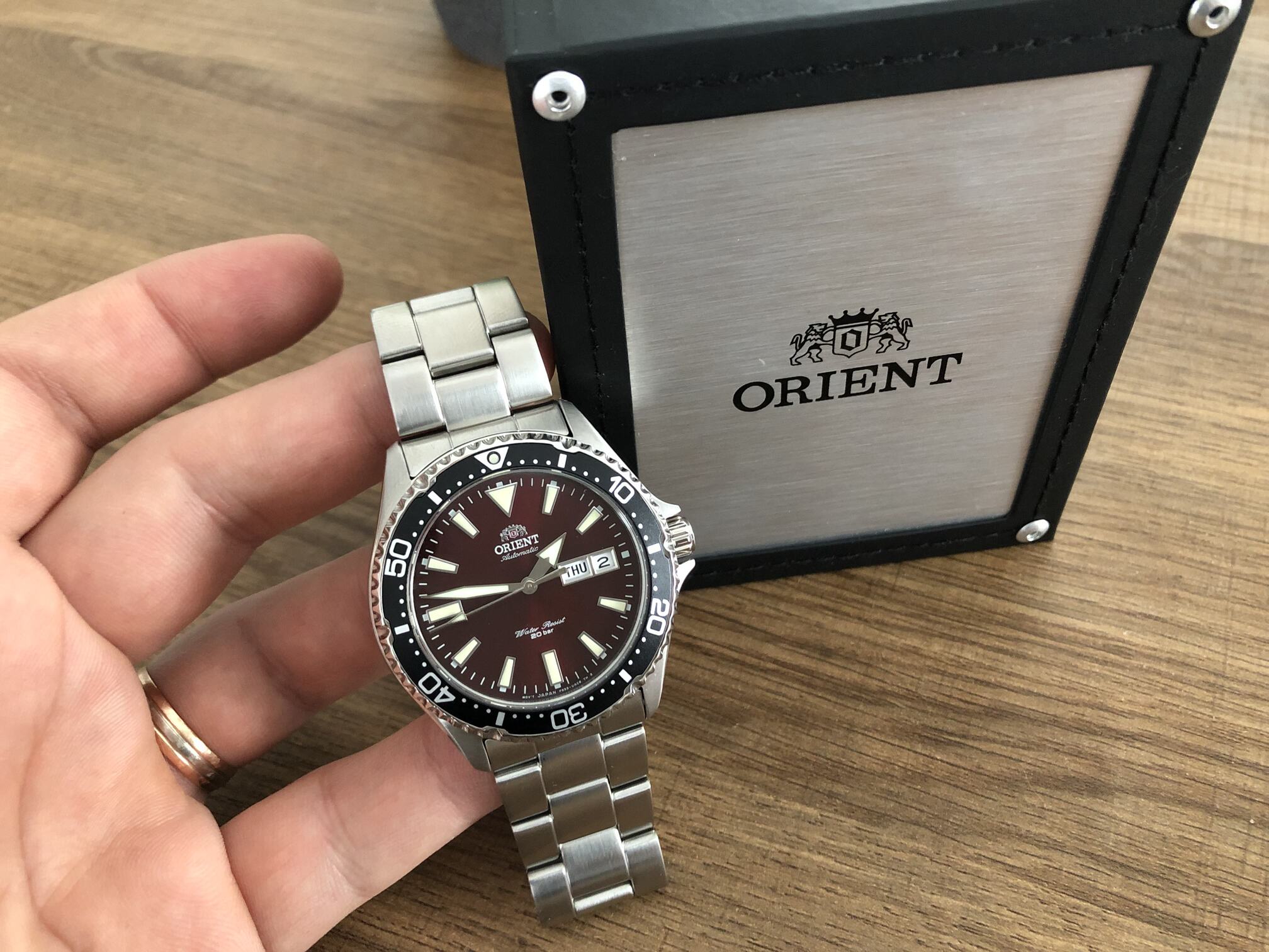 Orient watch with a box next to it