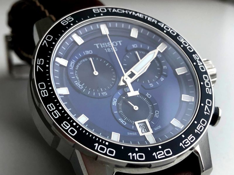 Swiss timepiece with sapphire crystal and tachymeter bezel